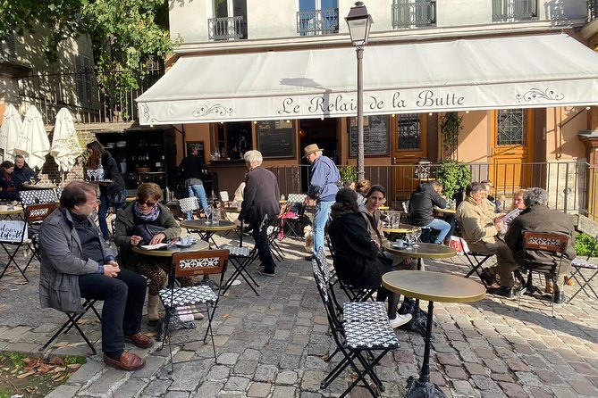 A café terrace spilling onto the cobbles on the Butte Montmartre