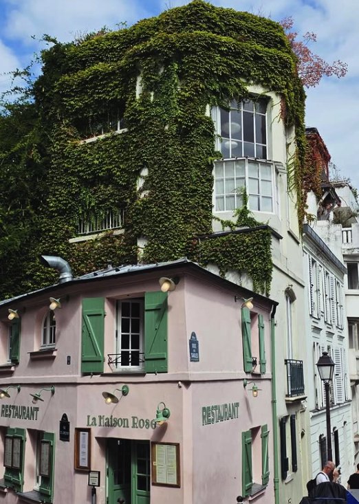 The ivy-covered corner of La Maison Rose on rue de l'Abreuvoir in Montmartre